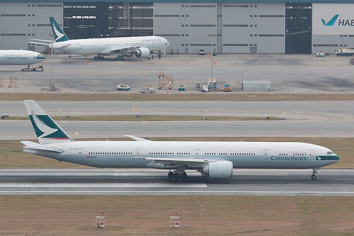 New_and_old_cathay_pacific_livery_on_Boeing_777-300ER_(22675855615)