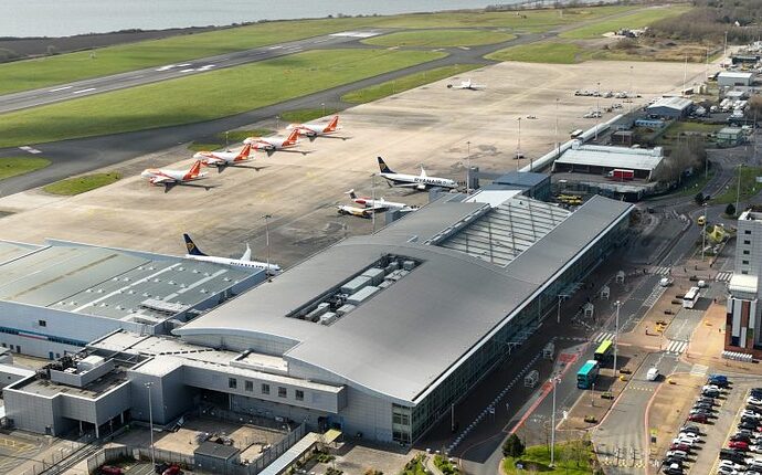 Top-of-terminal-building-western-section-of-airfield-and-runway-e1746719873822